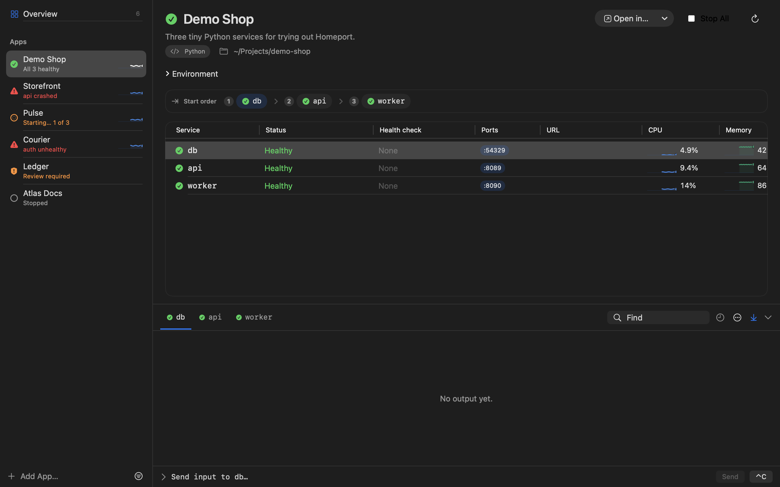 The Demo Shop app in Homeport, with its db, api and worker services healthy, their ports, CPU, and the api log.